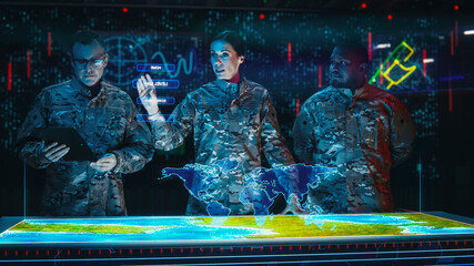 Futuristic High Tech Warfare: Military Intelligence Specialists use Augmented Reality Table Map to...