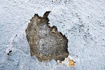 A Crack in a Concrete Wall With Rusted Surface - 775849007
