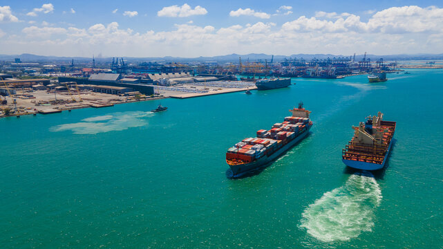the image provides a stunning aerial view of a bustling cargo ship port, where massive vessels dock and unload their precious cargo.