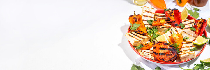 Summer vegan barbeque recipe. BBQ healthy balanced vegetarian food, grilled roasted tofu cheese steaks with vegetables