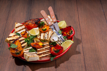 Summer vegan barbeque recipe. BBQ healthy balanced vegetarian food, grilled roasted tofu cheese steaks with vegetables