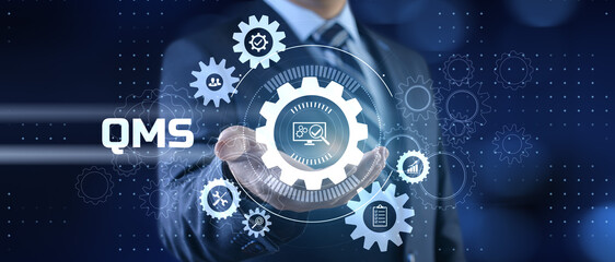 QMS Quality management system. Businessman pressing virtual button.
