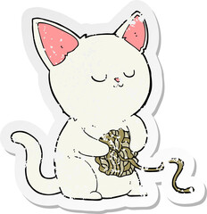 retro distressed sticker of a cartoon cat playing with ball of yarn