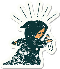 worn old sticker of a tattoo style assassin with knife