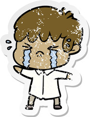 distressed sticker of a cartoon boy crying