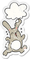 cartoon rabbit with thought bubble as a distressed worn sticker