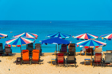 Karon Beach, one of the favorite beaches visited by tourists to play in the water, sunbathe or just enjoy the tropical climate in Phuket, Thailand. The beauty of Karon beach on a hot day