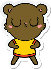 sticker of a peaceful cartoon bear