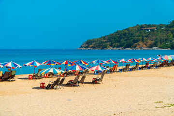 Karon Beach, one of the favorite beaches visited by tourists to play in the water, sunbathe or just enjoy the tropical climate in Phuket, Thailand. The beauty of Karon beach on a hot day