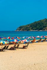 Karon Beach, one of the favorite beaches visited by tourists to play in the water, sunbathe or just enjoy the tropical climate in Phuket, Thailand. The beauty of Karon beach on a hot day
