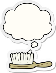 cartoon hairbrush with thought bubble as a printed sticker