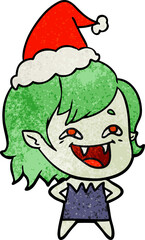 hand drawn textured cartoon of a laughing vampire girl wearing santa hat