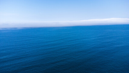 Aerial view of Atlantic Ocean and white cloud front. La Coruña, Galicia, Spain.