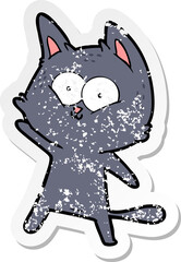 distressed sticker of a cartoon cat waving
