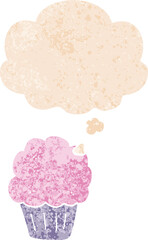 cartoon cupcake with thought bubble in grunge distressed retro textured style