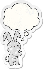 cute cartoon rabbit with thought bubble as a distressed worn sticker