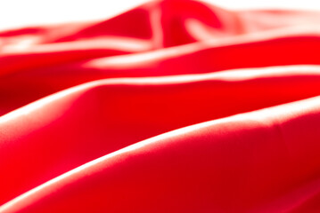 The bright red silk satin surface is beautiful and luxurious, wavy. For background and graphic work...