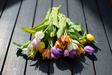 tulips displayed on garden table - 775883663