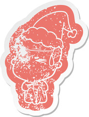 quirky cartoon distressed sticker of a man sweating wearing santa hat