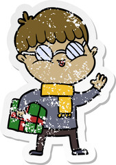 Obraz premium distressed sticker of a cartoon boy wearing spectacles carrying gift