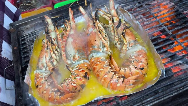 Close up easy homecook meal served several red orange color arranged aligned perfectly cooked garlic butter lobster tails with parley baked or broiled for lunch. and dinner
