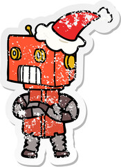 hand drawn distressed sticker cartoon of a robot wearing santa hat