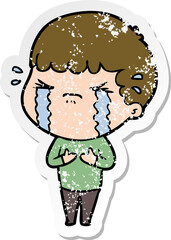 distressed sticker of a cartoon man crying