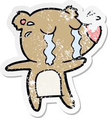 distressed sticker of a cartoon crying bear