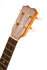 A closeup view of a ukulele headstock, showcasing the tuning keys, strings, and fretboard. The wooden body and gold hardware shine against a white background.