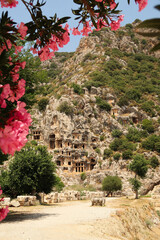 The entrance area to the ancient city of Myra, rock hewn, rock cut lycian tombs in the background,...