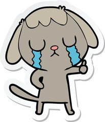 sticker of a cute cartoon dog crying