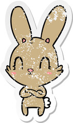 distressed sticker of a cute cartoon rabbit