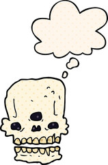 cartoon spooky skull with thought bubble in comic book style