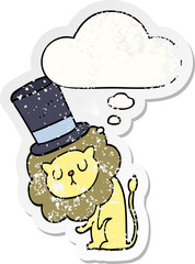 cute cartoon lion wearing top hat with thought bubble as a distressed worn sticker