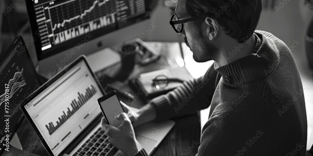Poster A man sitting at a desk using a laptop computer. Suitable for business and technology concepts