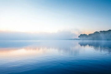 A quiet lake at dawn with mist over the water, creating a tranquil and spacious backdrop for serene summer themes