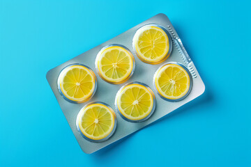 Slices of lemon like pills in a blister pack. Multivitamins and dietary natural supplements for a healthy diet. 