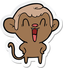 sticker of a cartoon laughing monkey