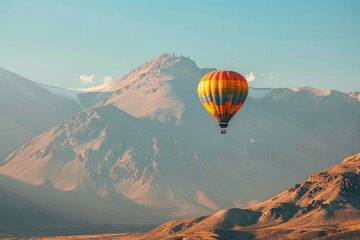 A creative and artistic photo of a hot air balloon flying over a mountain range