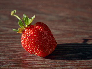 Red, juicy strawberries are on the table, a beautiful and delicious berry, a source of vitamins and good mood