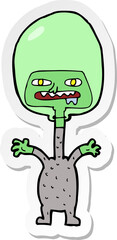 sticker of a cartoon space alien