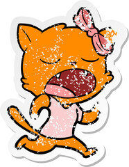 distressed sticker of a cartoon yawning cat