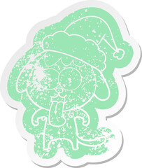 cute quirky cartoon distressed sticker of a dog wearing santa hat