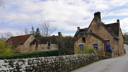Typical house in the village of Saint-Céneri-le-Gérei in the Orne region of the Alpes Mancelles France  - obrazy, fototapety, plakaty