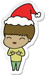 happy hand drawn sticker cartoon of a boy wearing santa hat