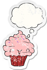 cute cartoon frosted cupcake with thought bubble as a distressed worn sticker