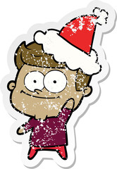 hand drawn distressed sticker cartoon of a happy man wearing santa hat