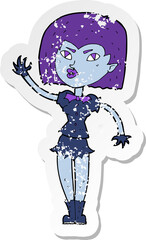 retro distressed sticker of a cartoon pretty vampire girl