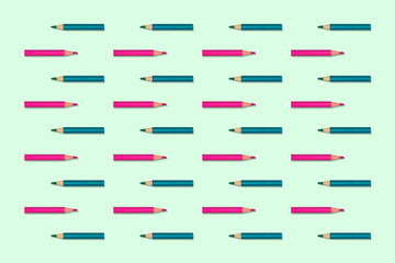 Horizontal image with small colored pencils forming an image pattern with contrasting background...