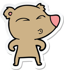 sticker of a cartoon whistling bear